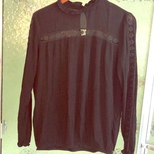 Beautiful black blouson top, arm & chest detail